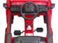 Voiture rouge pour enfant Land Rover vue de l'intérieur.