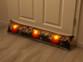 Coussin de porte à 3 LED avec motifs bougies - 90 x 20 cm